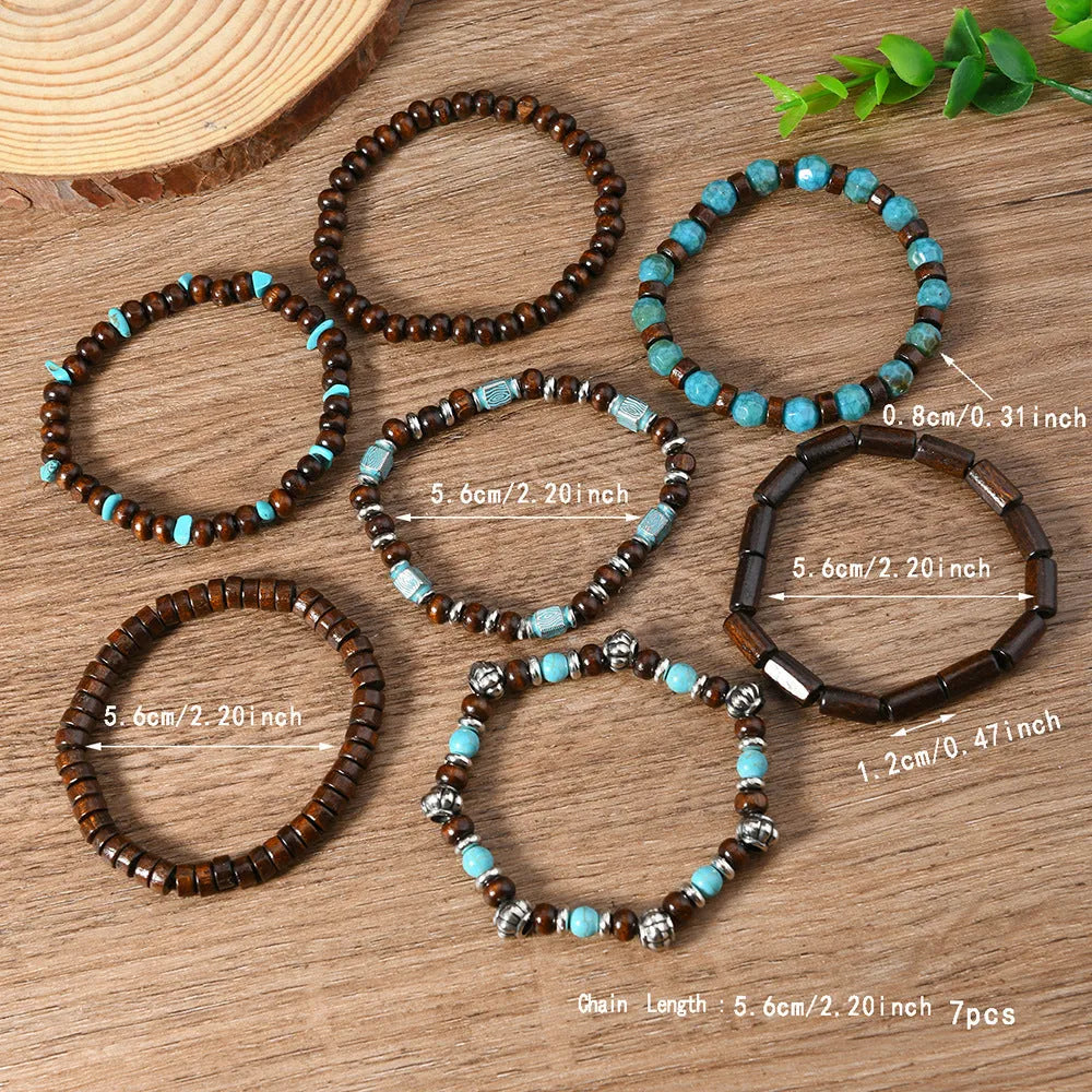 Seven multicolour wooden bead and alloy retro bracelets laid out showing round bead design