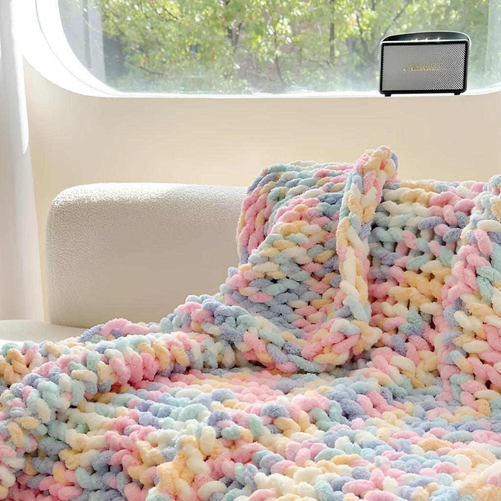 Thick striped chenille cover blanket in caramel mango colour, folded to show texture and handmade ice-bar pattern.