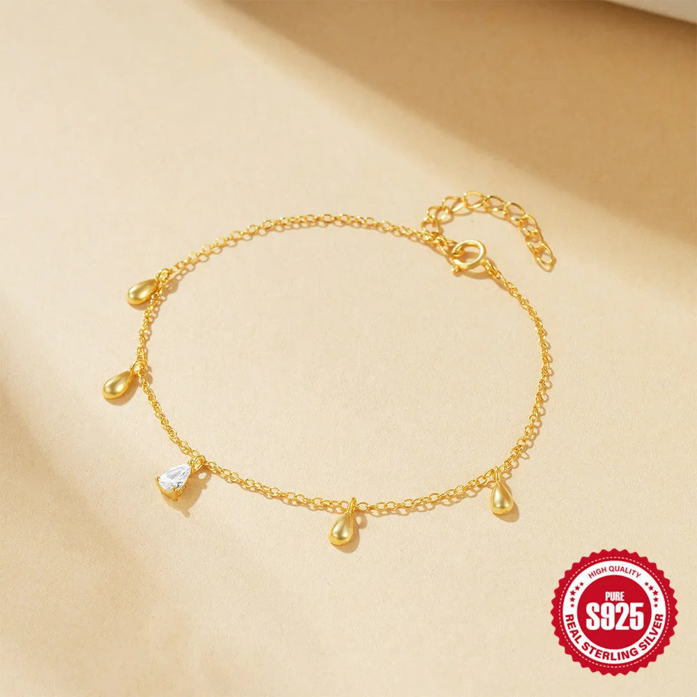 S925 sterling silver bracelet with geometric water drop pendant and diamond accents in gold colour
