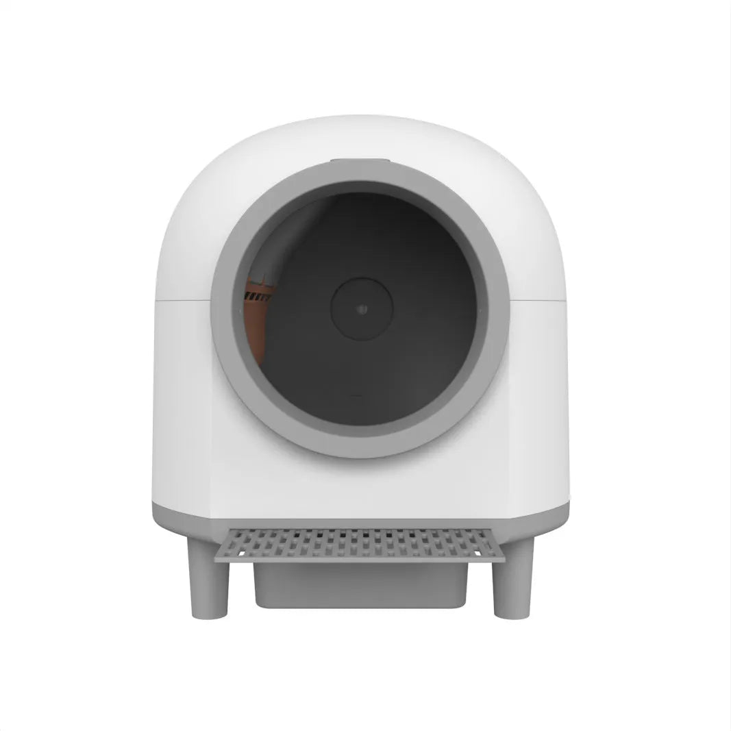 White fully enclosed automatic cat litter box for indoor use with cats.