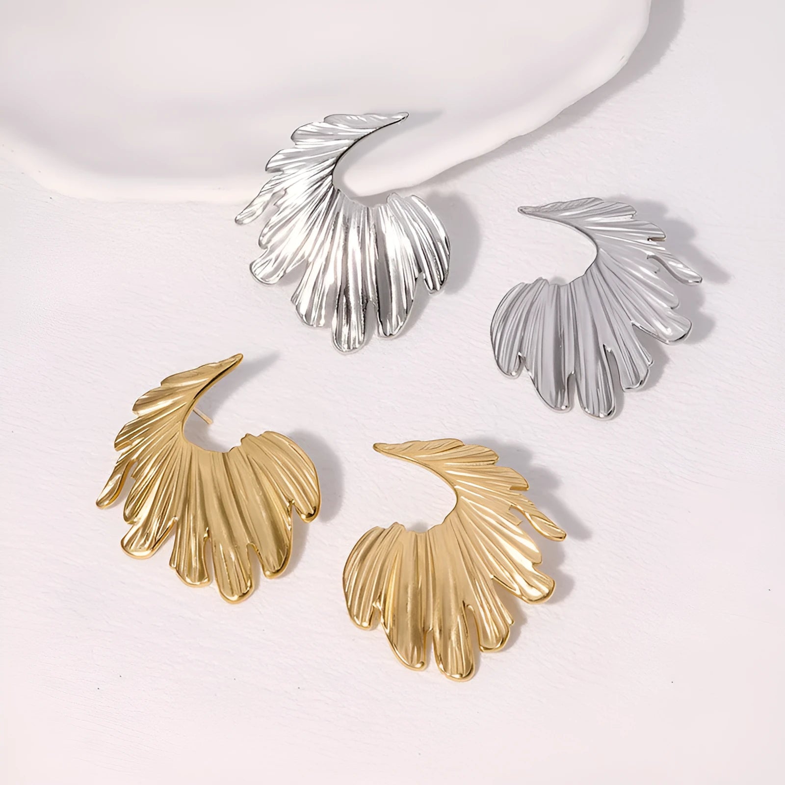 Retro leaf-shaped stainless steel stud earrings in gold or steel electroplated finish