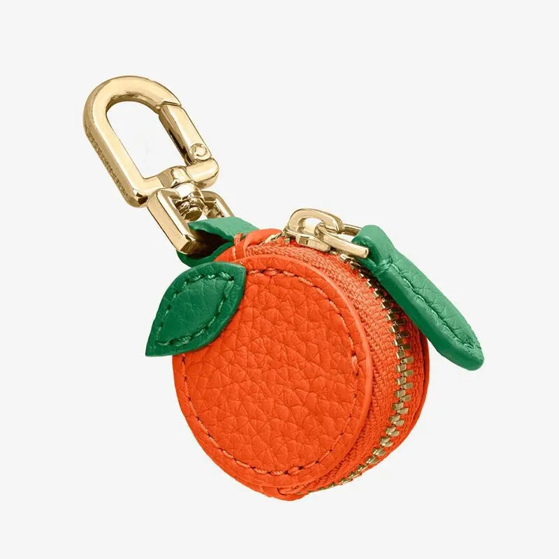 Mini leather coin purse keychain with zip and clip in cherry red colour.