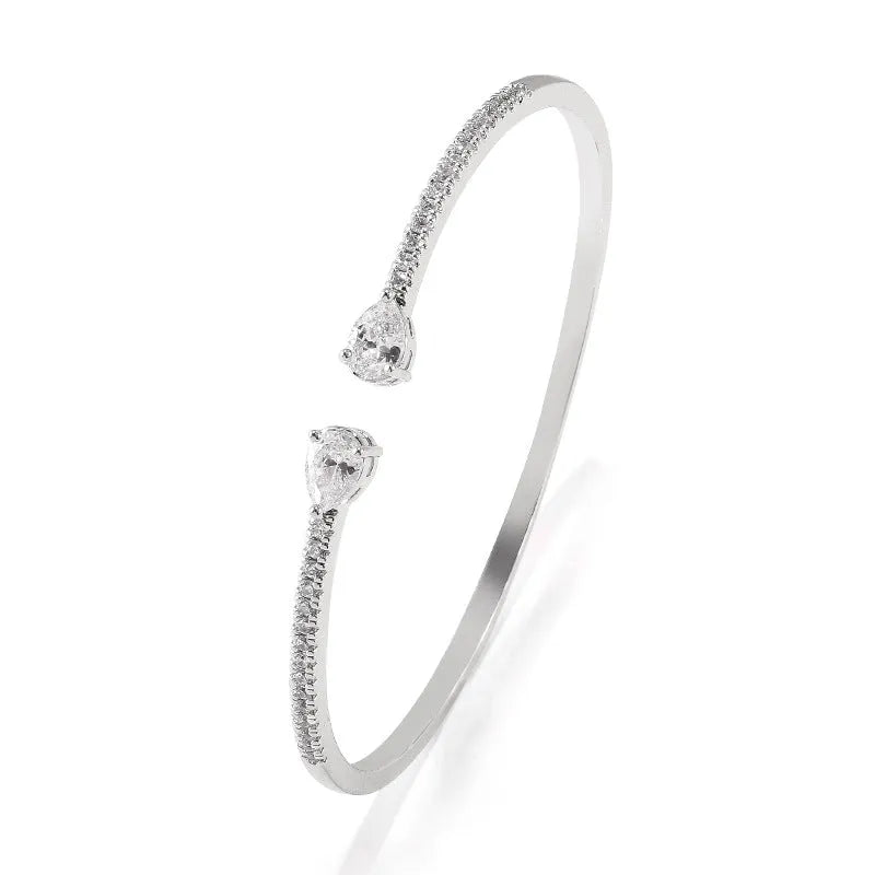 Personalised copper bracelet with multi-zircon inlay, shown in white and blue colour options