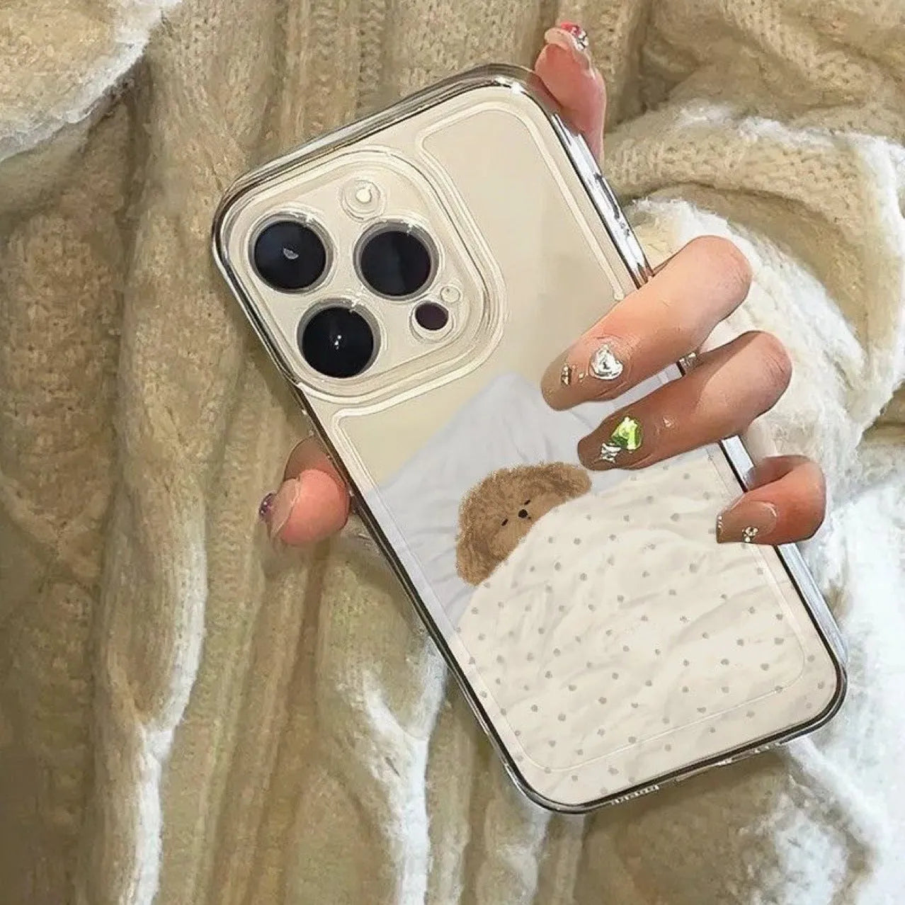 Transparent Apple iPhone case showing sleeping cat space shell pattern on TPU material