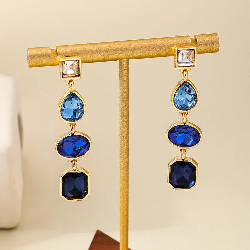 Pair of alloy geometric water drop stud earrings for women in rose red colour