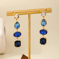 Pair of alloy geometric water drop stud earrings for women in rose red colour