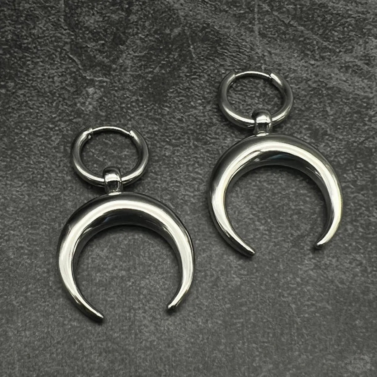 Silver geometric moon hoop earrings with punk gothic style and ear clip fastening
