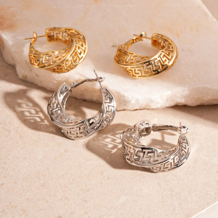 Women's geometric stud earrings with hollow twisted round design in silver or gold tone