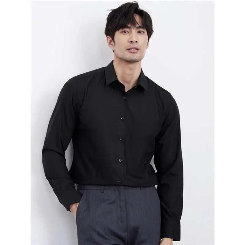 Man wearing a wine red slim fit long sleeve business casual shirt.