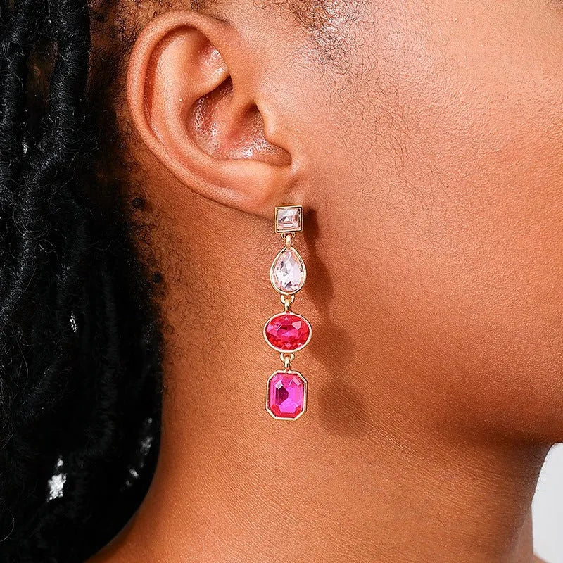 Pair of alloy geometric water drop stud earrings for women in rose red colour