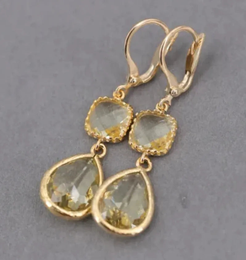 Gold geometric long fringe drop earrings with exaggerated crystal and water droplet design