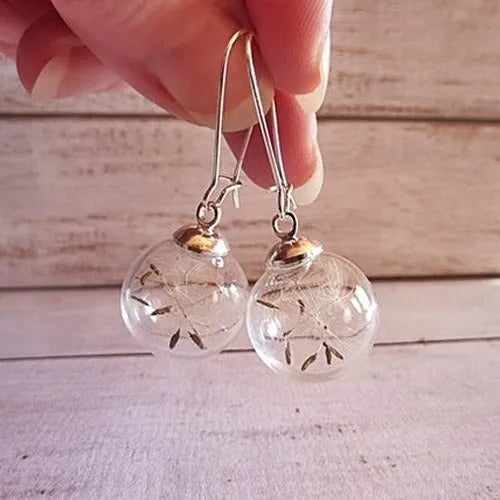 Transparent glass ball earrings with crystal dandelion seed design on silver French hooks