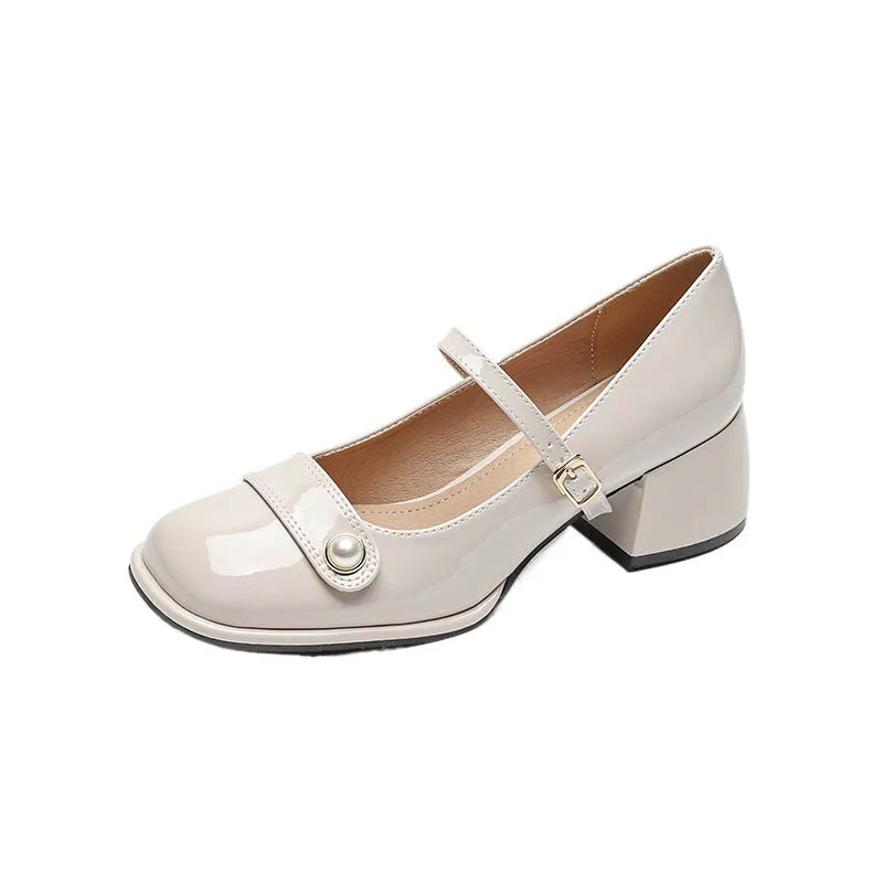 French style chunky heel pump shoes with buckle closure in patent leather, showing square toe design.