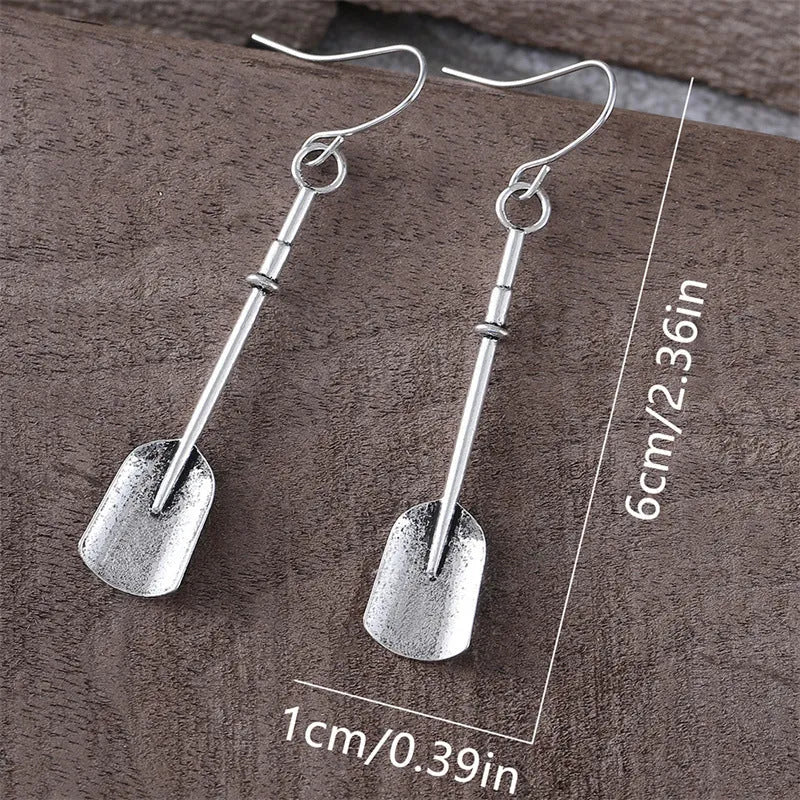 Long geometric shovel-shaped earrings with ancient silver finish and ethnic styling
