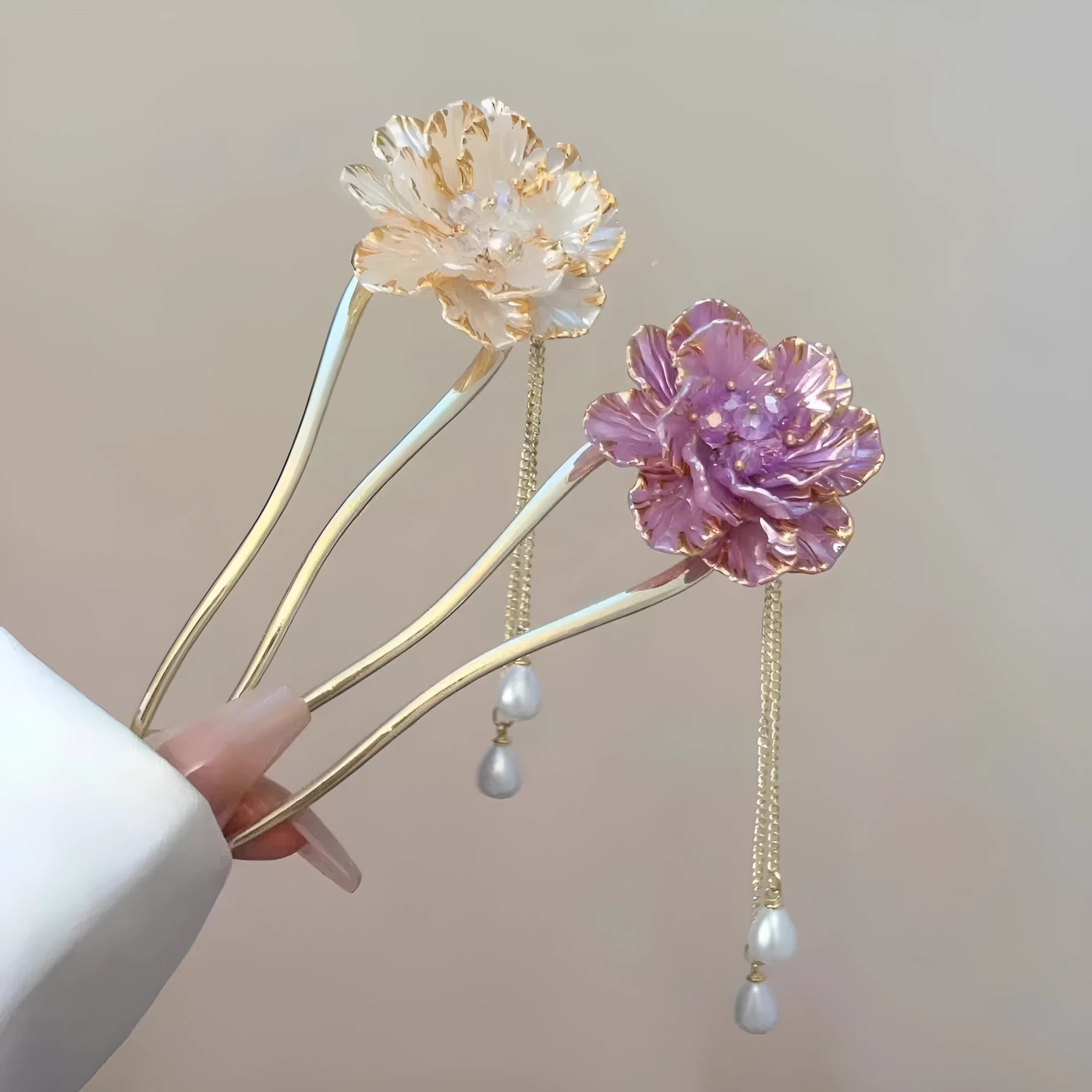 Close-up of a purple peony flower and tassel on a gold-toned U-shaped alloy hairpin.
