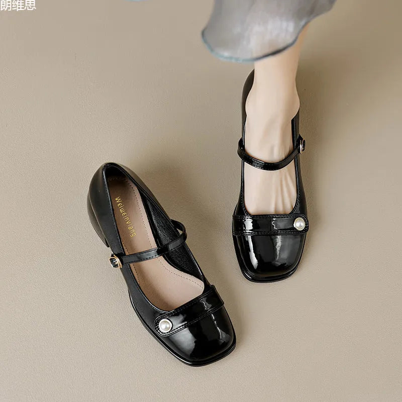 French style chunky heel pump shoes with buckle closure in patent leather, showing square toe design.