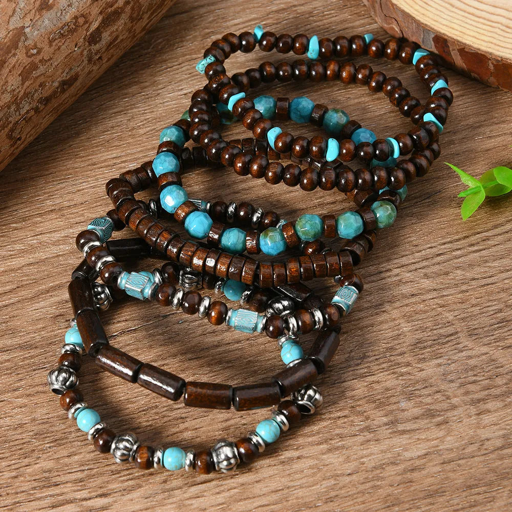 Seven multicolour wooden bead and alloy retro bracelets laid out showing round bead design