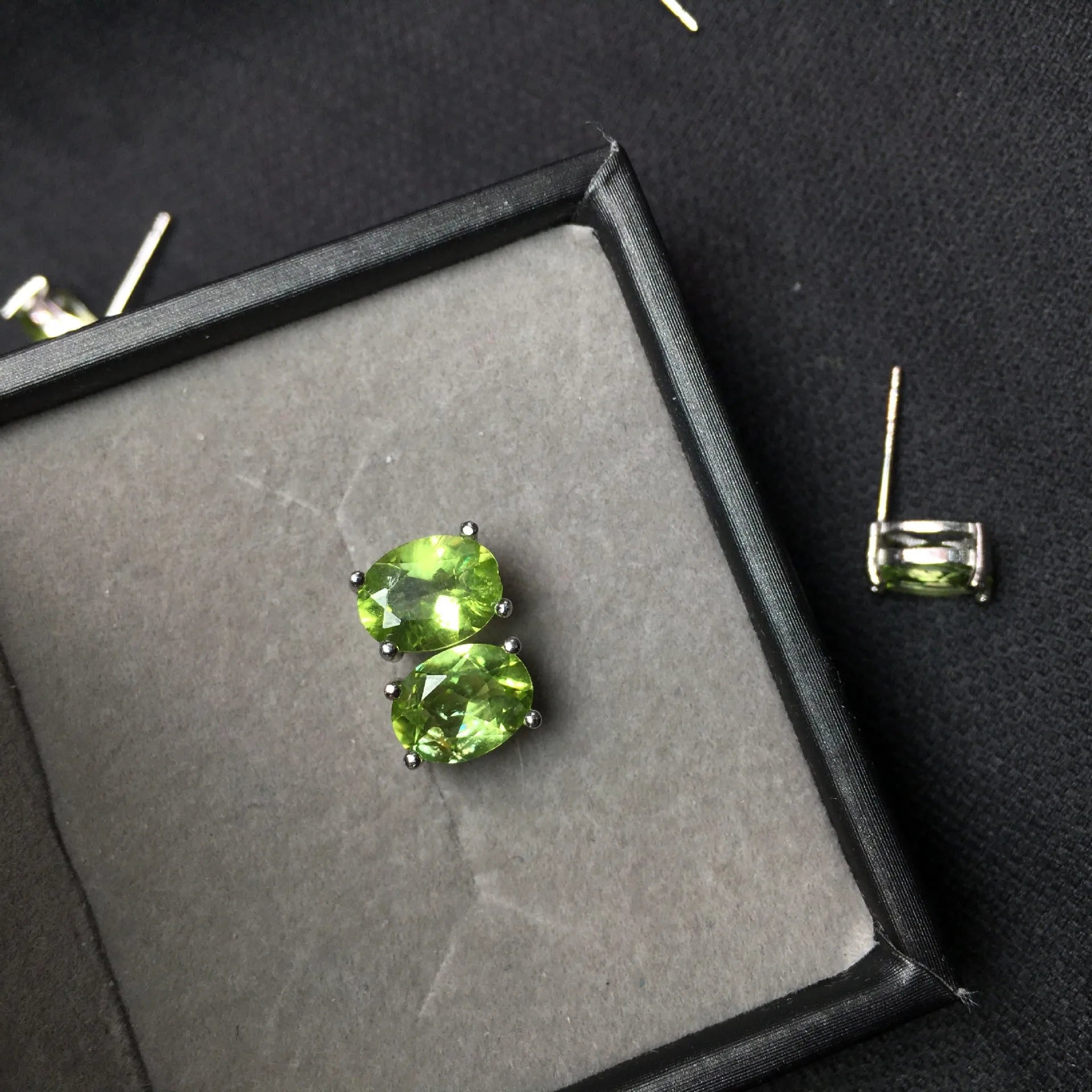 Natural grass green olivine 6x8mm elliptical stud earrings in sterling silver setting