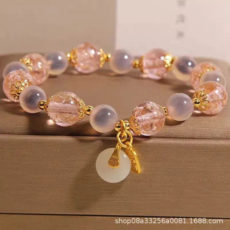 Women's pink heart agate bracelet with peace buckle closure and luminous glaze details