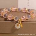 Women's pink heart agate bracelet with peace buckle closure and luminous glaze details
