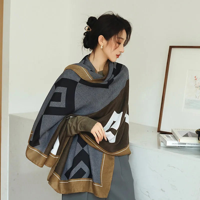 A woman wearing a printed polyester shawl, showcasing one of three available elegant styles, with dimensions of 180cm by 90cm.