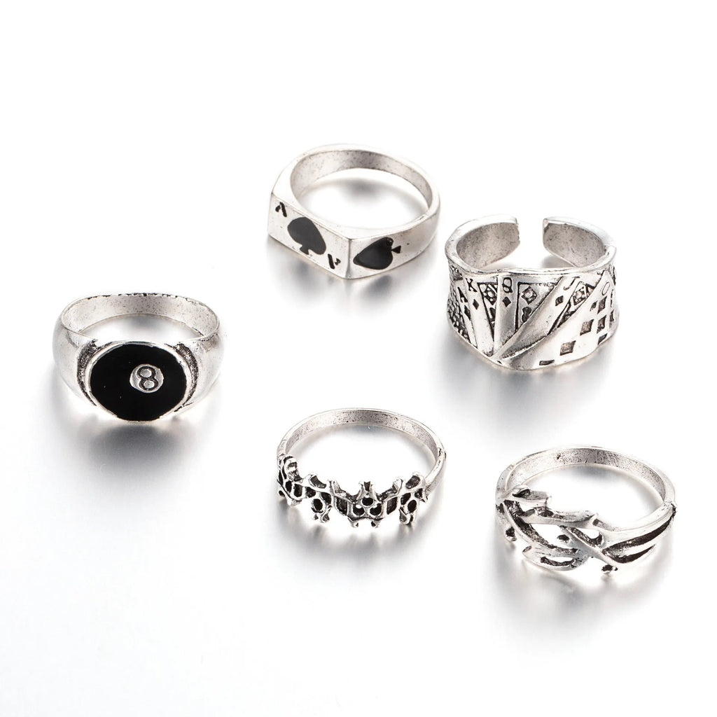 Black alloy poker ring with raised spade card design on adjustable band