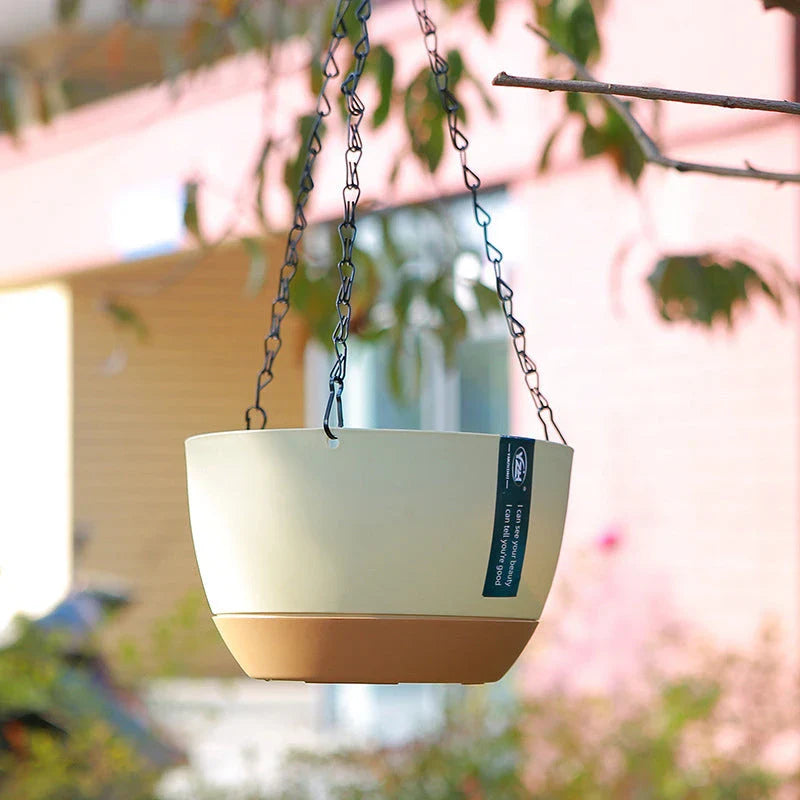 A set of modern, durable hanging flower pots in a natural, uncoated finish for indoor or outdoor use