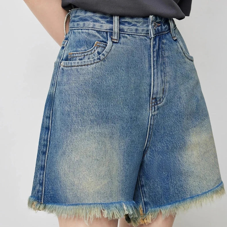 Premium high-waisted denim shorts with playful tassel detailing, perfect for summer outings in New Zealand