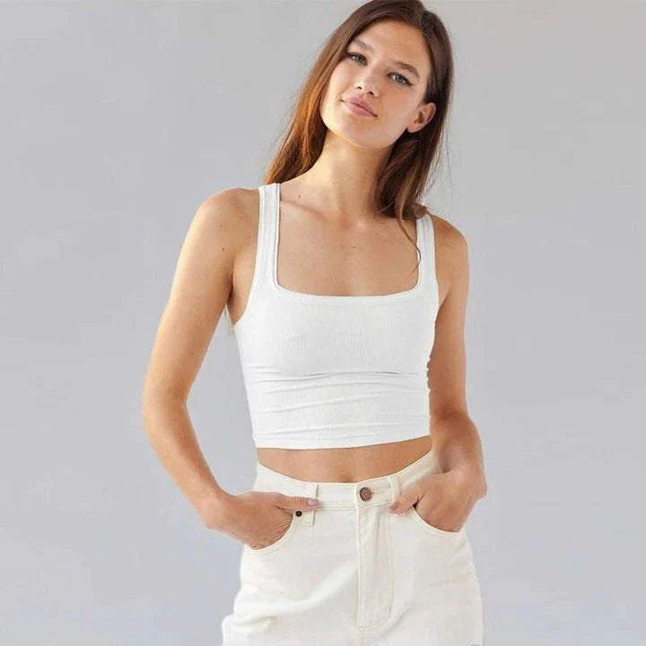 A stylish knitted sleeveless crop top in a solid brown color, perfect for Kiwi summer fashion.