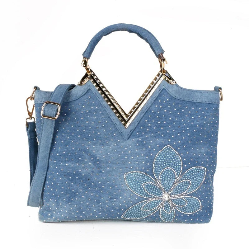 Light blue denim crossbody bag with a v-shaped diamond flower design, perfect for everyday use.