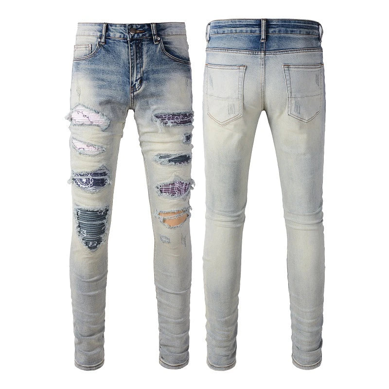 Stylish men's ripped jeans in light blue, featuring a unique distressed look and skinny-fit silhouette inspired by New Zealand's high-street fashion