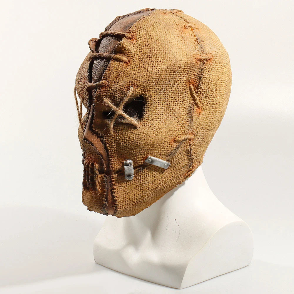 A lifelike, terrifying Halloween horror latex mask with a bleeding sack skull design