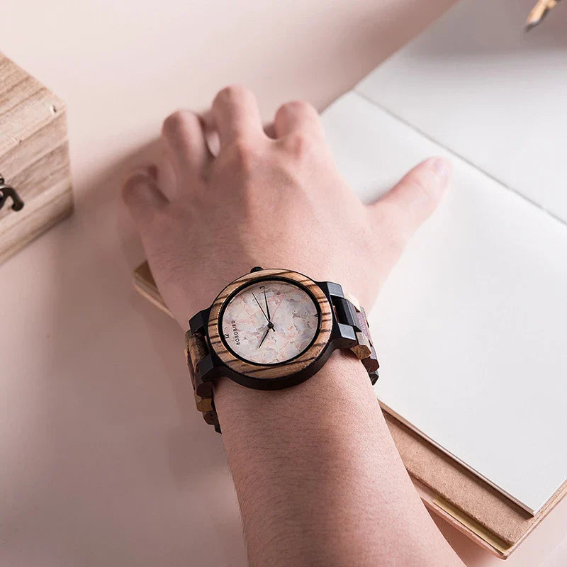 A close-up view of a stylish wooden watch with a minimalist design, showcasing the natural beauty of the wood material.