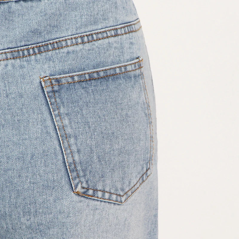 Wide-leg denim pants in classic blue, featuring a high-waisted, flattering silhouette and slightly elastic waistband for Kiwi-cool comfort and style.