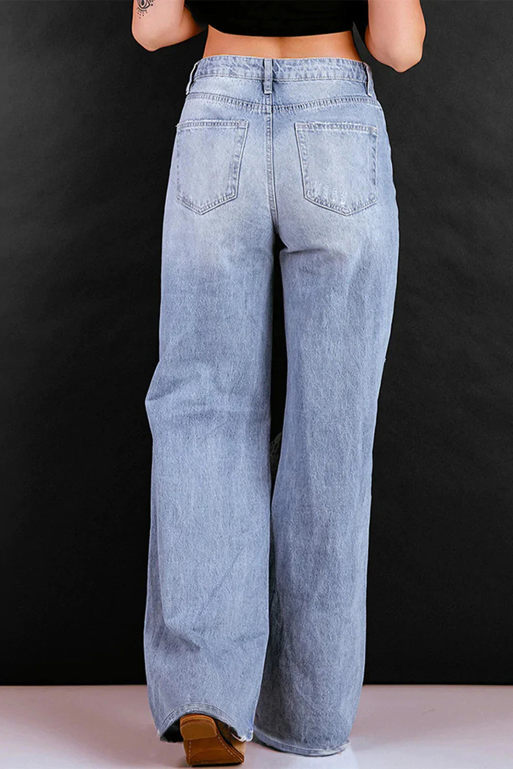 Sustainable Straight-Leg Denim Trousers in a classic blue wash, featuring a high-waisted design and relaxed, flattering fit