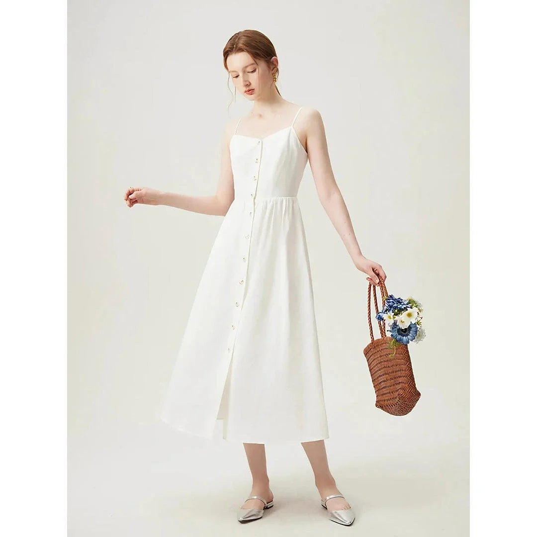 Sustainable Cozy Cotton and Linen Vacation Dress in a mid-calf length with a flattering empire waistline and spaghetti straps, perfect for Kiwi summers.