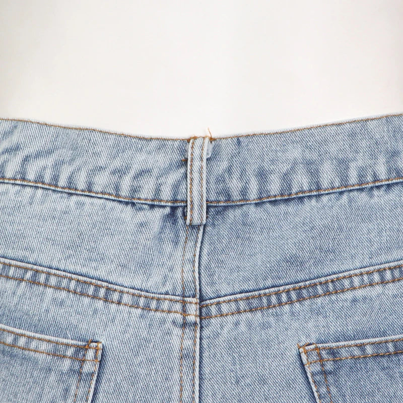 Wide-leg denim pants in classic blue, featuring a high-waisted, flattering silhouette and slightly elastic waistband for Kiwi-cool comfort and style.