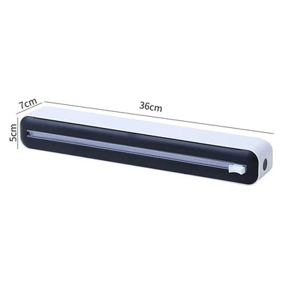 Versatile magnetic kitchen wrap dispenser with slide cutter for managing cling film, foil, and baking paper in a Kiwi kitchen