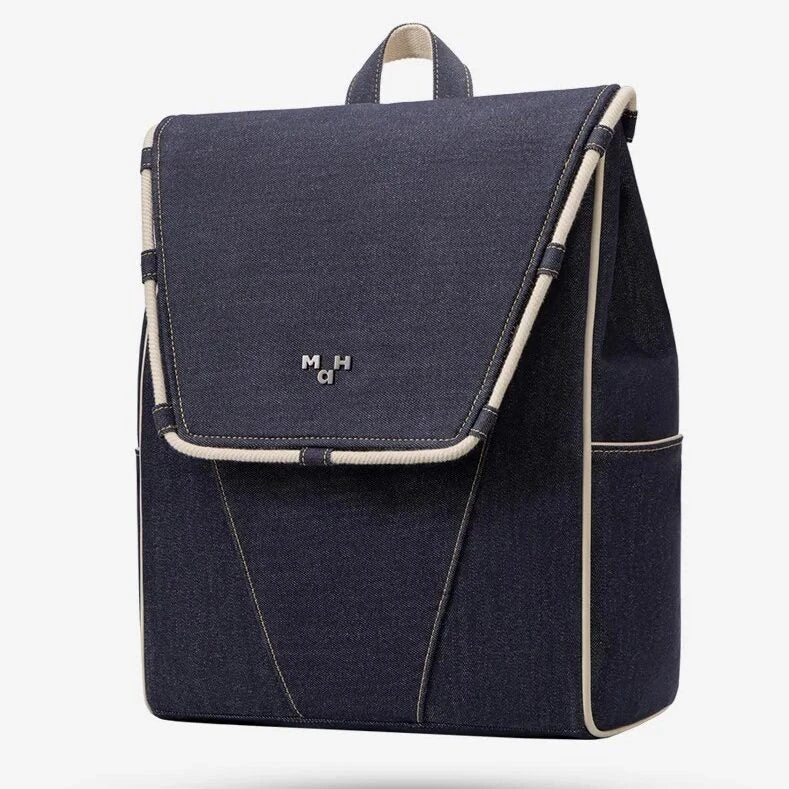 A sustainable and stylish denim backpack with multiple interior pockets and a waterproof lining, perfect for outdoor adventures.