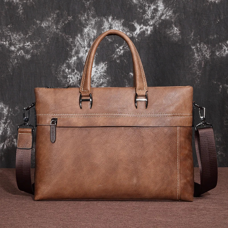 A stylish leather laptop bag featuring a classic Kiwi-inspired design, with a hidden zipper compartment, mobile phone pocket, and ID sleeve for optimal organization.