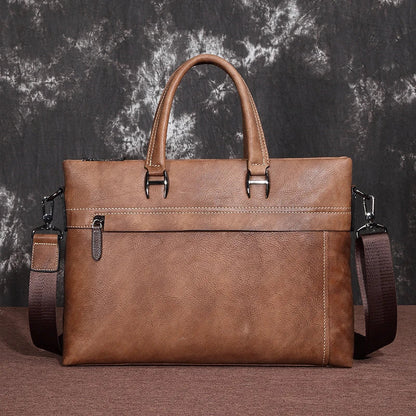 A stylish leather laptop bag featuring a classic Kiwi-inspired design, with a hidden zipper compartment, mobile phone pocket, and ID sleeve for optimal organization.