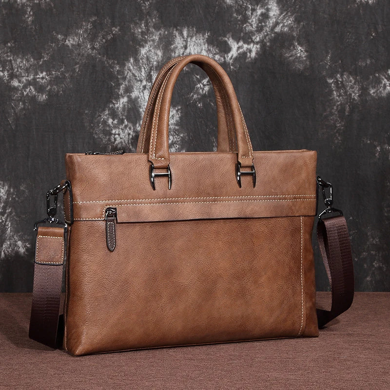 A stylish leather laptop bag featuring a classic Kiwi-inspired design, with a hidden zipper compartment, mobile phone pocket, and ID sleeve for optimal organization.