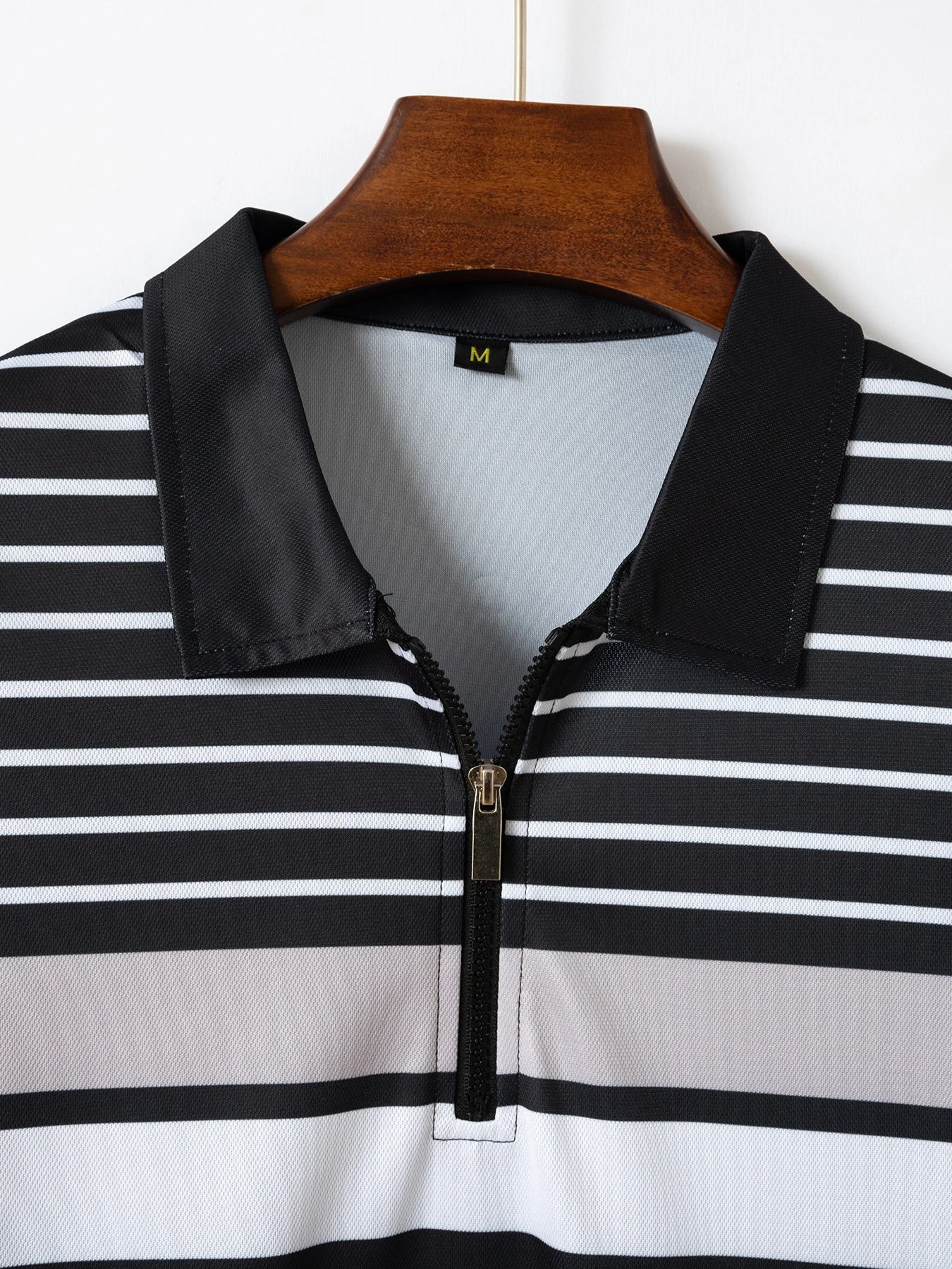 Versatile striped t-shirt in black, a premium Kiwi-made casual essential with a relaxed, comfortable fit