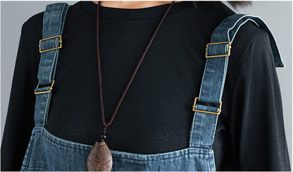 Premium, distressed denim overalls with a high-waisted fit and nine-inch leg length, designed for the modern Kiwi woman