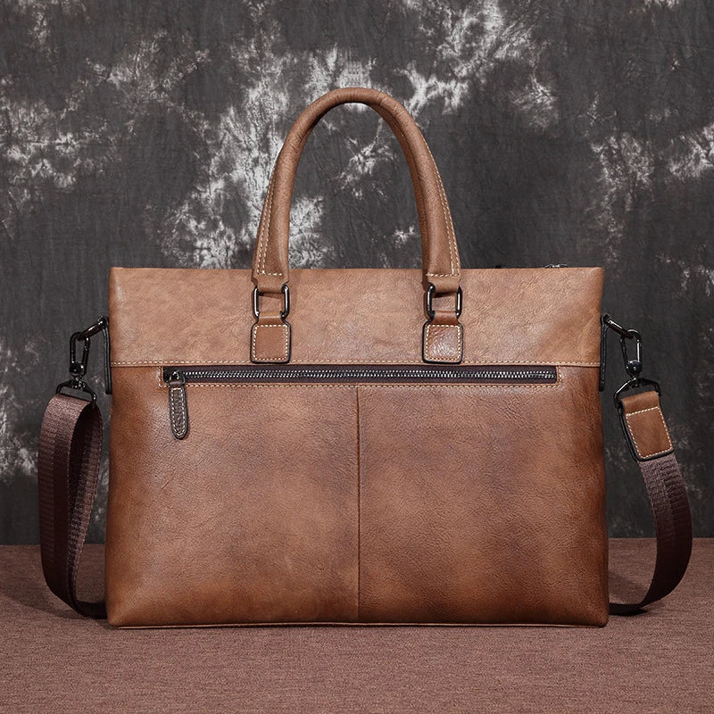 A stylish leather laptop bag featuring a classic Kiwi-inspired design, with a hidden zipper compartment, mobile phone pocket, and ID sleeve for optimal organization.