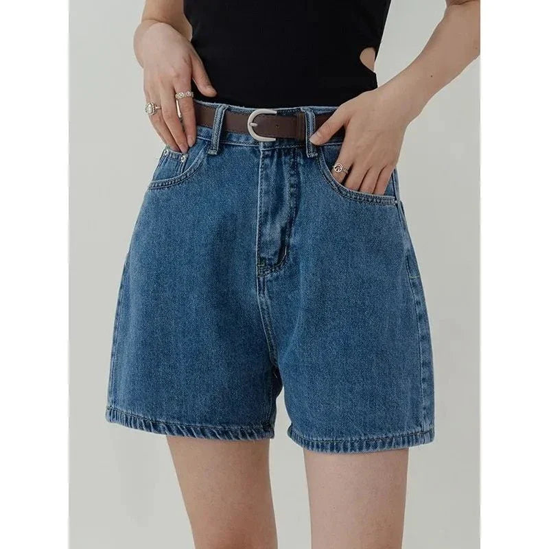 Casual high-waisted denim shorts in a chic blue hue, perfect for kiwi summer style