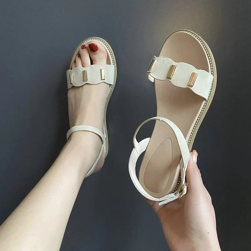 Stylish flat sandals with unique one-word buckle design, available in black, green, and beige colors