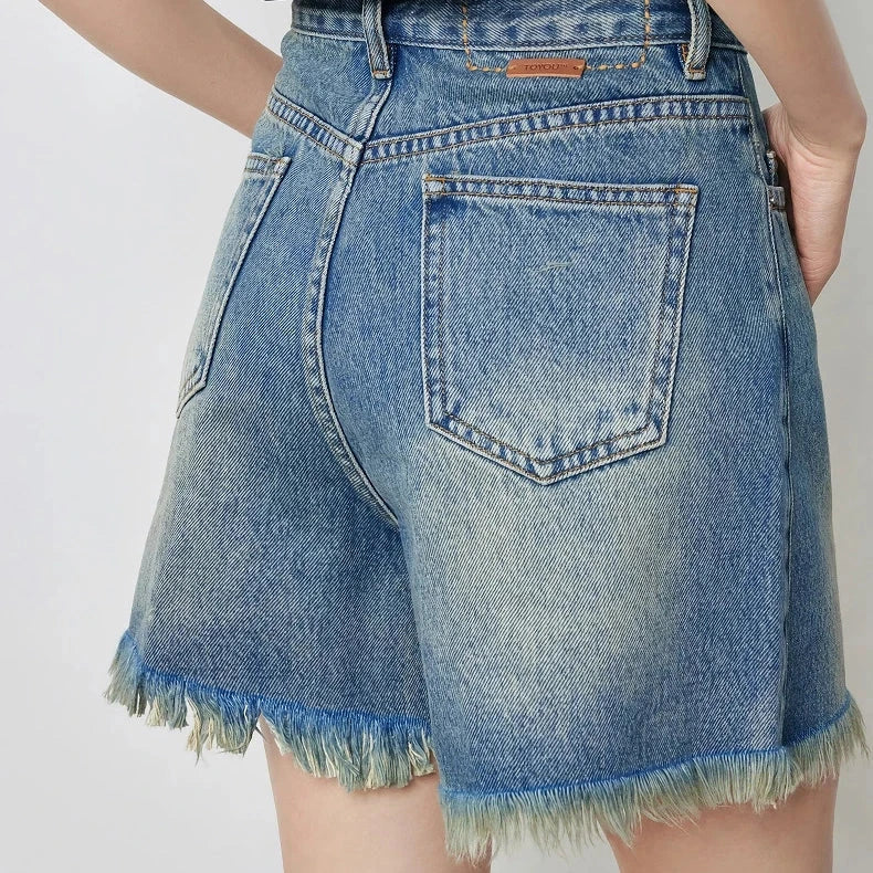 Premium high-waisted denim shorts with playful tassel detailing, perfect for summer outings in New Zealand