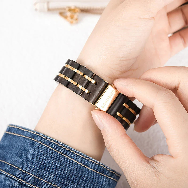 A close-up view of a stylish wooden watch with a minimalist design, showcasing the natural beauty of the wood material.