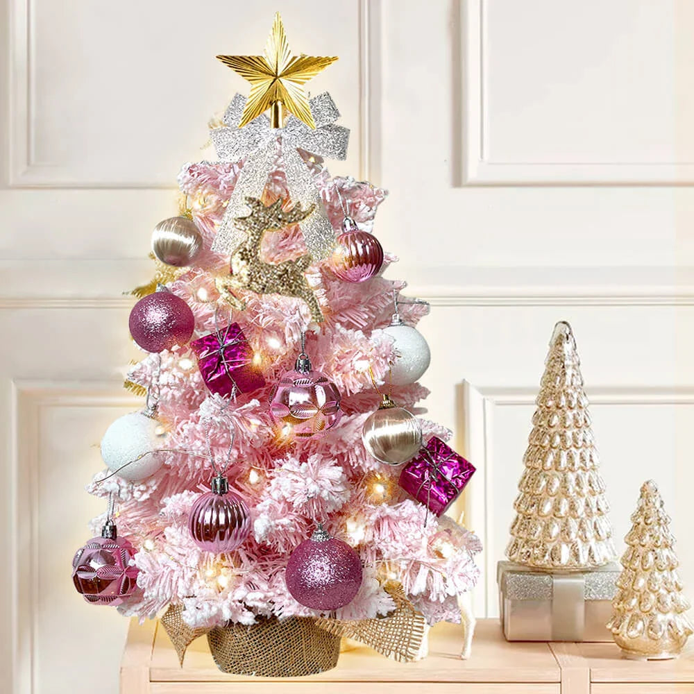 A 2ft mini Christmas tree with flocked snow design, lights, and ornaments for festive tabletop decoration in New Zealand homes and offices.